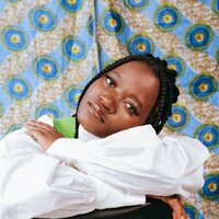 Image of Beckah Amani linking to their artist page due to link from them being at the top of the main table on this page