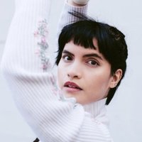 Image of Briana Marela linking to their artist page due to link from them being at the top of the main table on this page