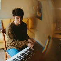 Image of Chris Bloom linking to their artist page due to link from them being at the top of the main table on this page