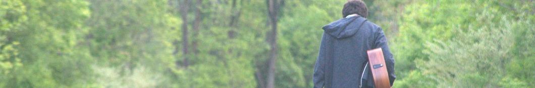Large banner image of John Molinaro linking to their artist page due to them being the most commonly displayed artist on this title page