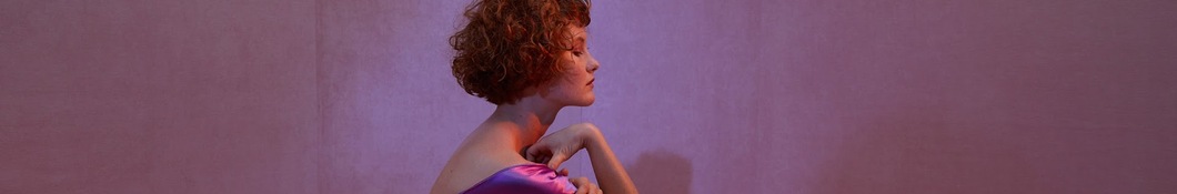 Large banner image of Kacy Hill headlining the page as they are the first listed artist for the Vapor Soul genre