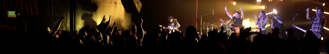Large banner image of Kaleb Austin linking to their artist page due to them being the most commonly displayed artist on this title page