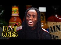 Thumbnail for the Kai Cenat - Calls Sean a Liar While Eating Spicy Wings | Hot Ones link, provided by host site