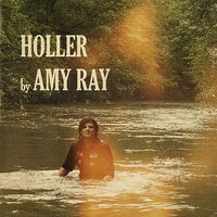Image of Amy Ray linking to their artist page due to link from them being at the top of the main table on this page