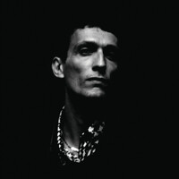 Image of Johnny Hostile linking to their artist page due to link from them being at the top of the main table on this page
