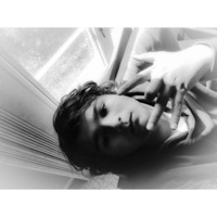 Image of Grey linking to their artist page due to link from them being at the top of the main table on this page