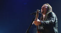 Thumbnail for the Travis Tritt - Love of a Woman link, provided by host site