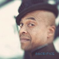 Image of Angelo Moore linking to their artist page due to link from them being at the top of the main table on this page