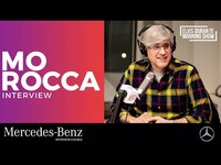 Thumbnail for the Mo Rocca - Shares Experience On 'Jeopardy!' And Talks 'Mobituaries' Podcast link, provided by host site
