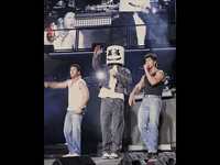 Thumbnail for the Jonas Brothers - Slow Motion ft. Marshmello live at MetLife Stadium. Listen to Greetings From Your Hometown - out now link, provided by host site