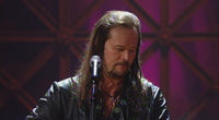 Thumbnail for the Travis Tritt - Strong Enough to Be Your Man (from Live & Kickin') link, provided by host site