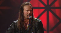 Thumbnail for the Travis Tritt - Ten Feet Tall and Bullet Proof link, provided by host site
