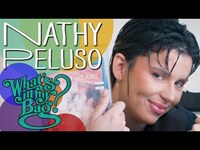 Thumbnail for the Nathy Peluso - What's In My Bag? link, provided by host site