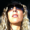 Image of Suz linking to their artist page due to link from them being at the top of the main table on this page
